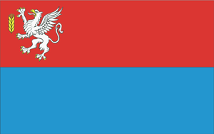Flaga gminy, dwa pasy poziome czerwony a następnie błękitny z gryfem i kłosem zboża w lewym górnym rogu